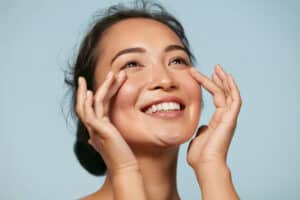 Closeup of woman with beautiful, glowing skin smiling